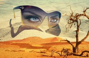 Fantasy, Surreal collage, female Eyes in Eyeglasses on sand