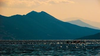 turquoise sea on a background of mountains in Greece