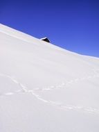 hut roof on the snowy mountain