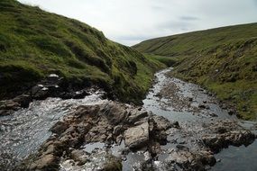 Rocks on river bed in wilderness, Iceland