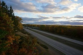 paved highway along the autumn forest in America
