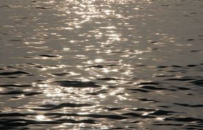 glimpses of the sun on the sea surface in Thailand