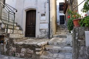 aged stone stairs in alley, italy