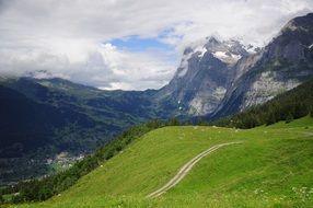 white clouds over the mountains of switzerland