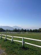 fenced farm field on the background of Mount Fuji