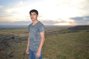 young man and landscape of the plain