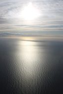 reflection of the silver sun in the sea