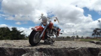 harley davidson motorcycle, miniature model on stone outdoor