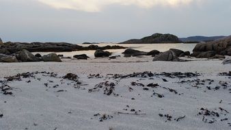 snow on the beach in Scotland at dusk