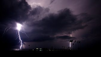 bright lightning during a thunderstorm over the beach