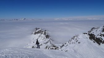 mountain in the snow under the clouds