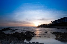 distant view of a bright sunset over malaga