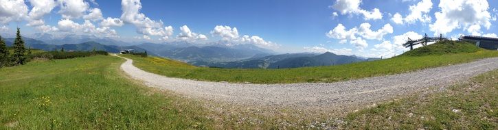 road in the austrian alps on a sunny day