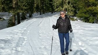 Hiking and skiing in the snowy forest