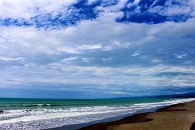 sky in thick white clouds above the beach
