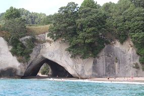 passage in a rock on the coast of new zealand