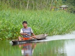 child on a boat on a river in peru