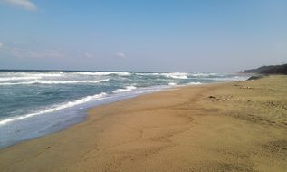 foamed Sea Waves splashing on sand beach, Korea