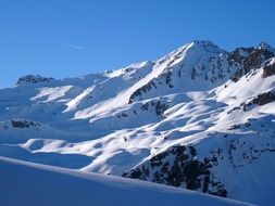 panorama of snowy alps on a sunny day