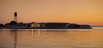 view from the ocean to the coast at sunset