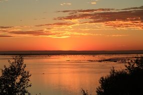 orange dawn over the water