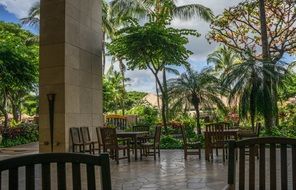 chairs and tables on terrace at palm trees, usa, Hawaii, Oahu, Resort Ko Olina