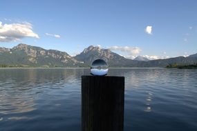 Forggensee lake in a glass ball