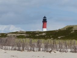 lighthouse behind the rock