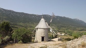 ancient mill amid picturesque landscape in languedoc roussillon