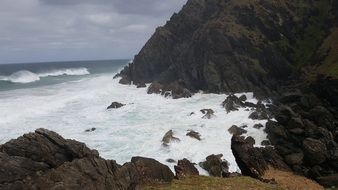 foamy surf of the ocean on the rocks