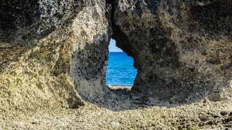 stone window at cape cavo greco in cyprus