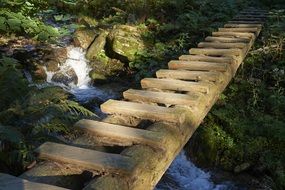 bridge over a stream in a park of slovakia