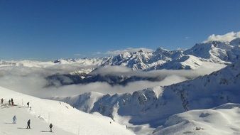 landscape of people walk on a snowy mountain