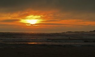 yellow sunset in the clouds over the coast of brazil
