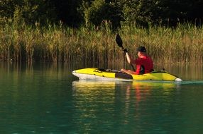 the man in the yellow kayak
