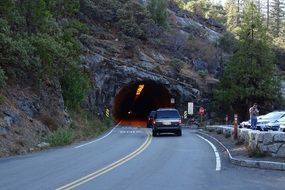 cars in front of a tunnel in yosemite national park