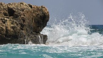 waves breaking on the rocks in ayia napa