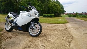 white motorcycle among nature