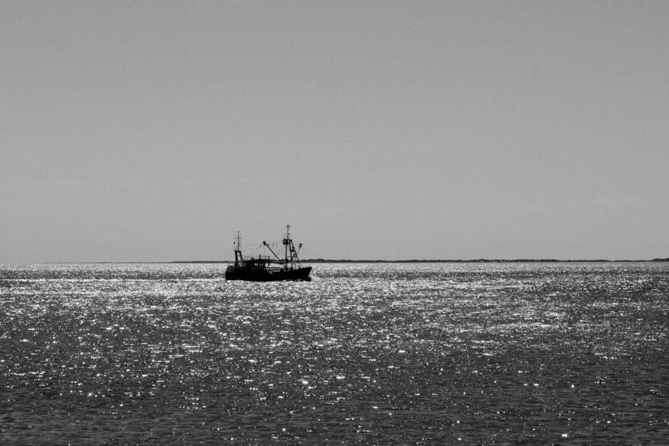 monochrome photo of yacht on the seashore in Norderney, Germany