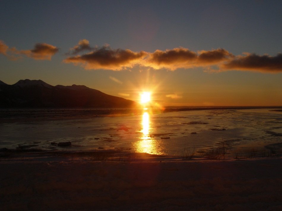 Beautiful and colorful sunset above the water in Anchorage, Alaska