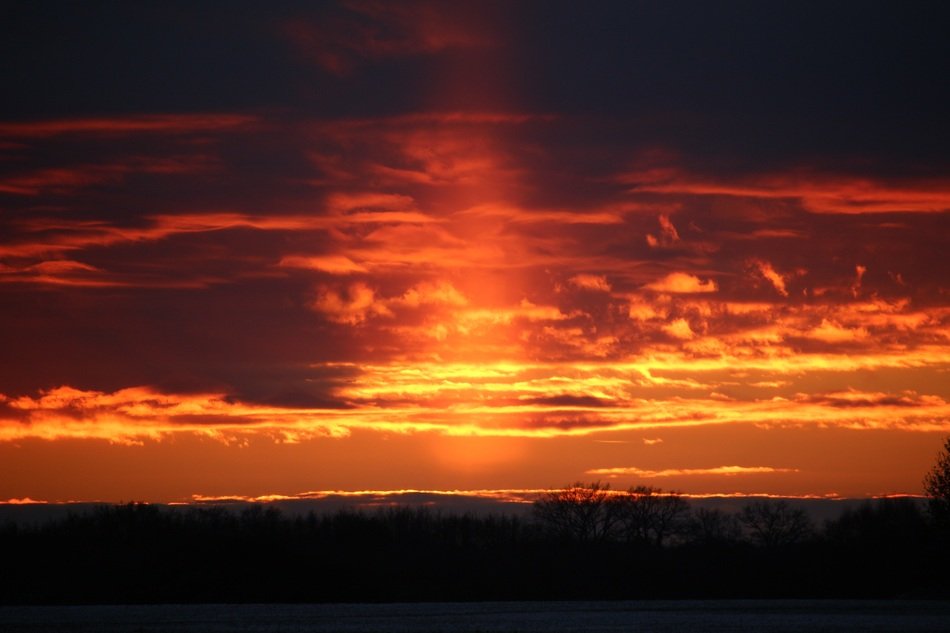 Sunpillar through the cloudy sky