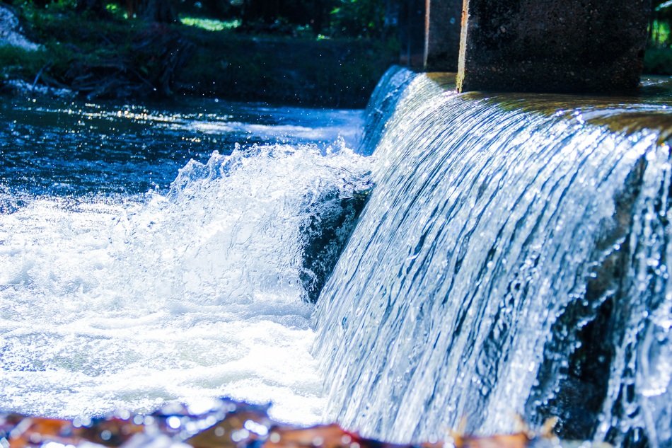 waterfall on the lake on a sunny day