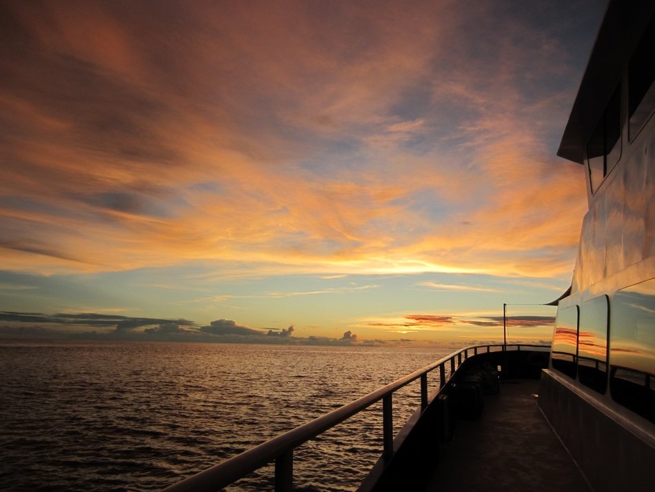 view from the ship at sunset in the clouds