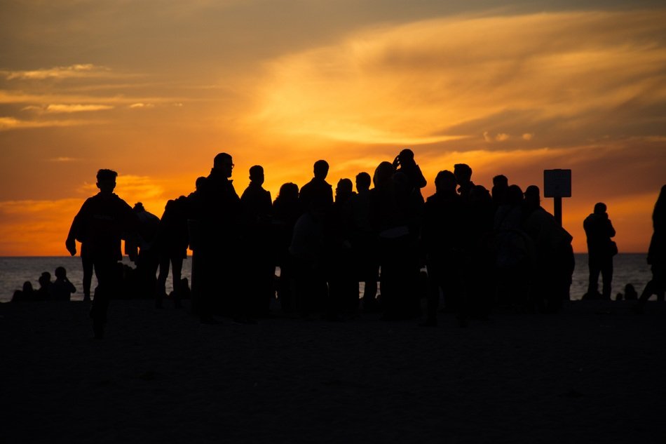 group of people on a background of orange sky