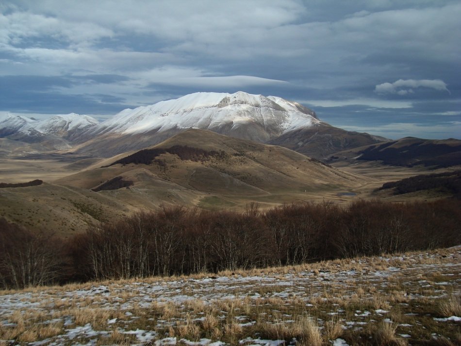 snowy mountains and brown hills in Umbria
