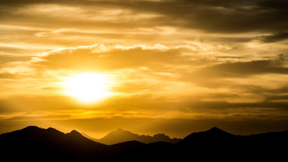 Golden sky over the dark mountains in Arizona