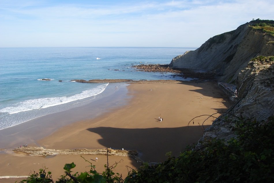 panorama of the rocky coastline over the sandy beach