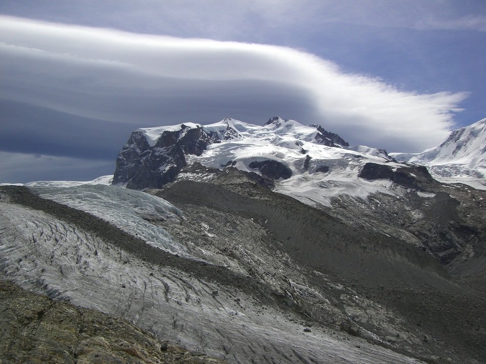 clouds over mountain massif monterosa