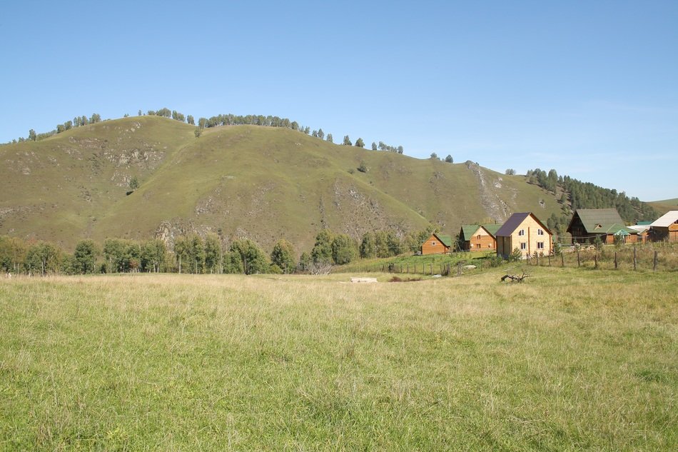 village on the background of Altai mountains