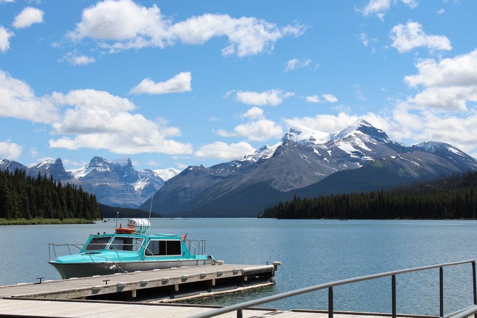 boat on a lake among canadian rockies